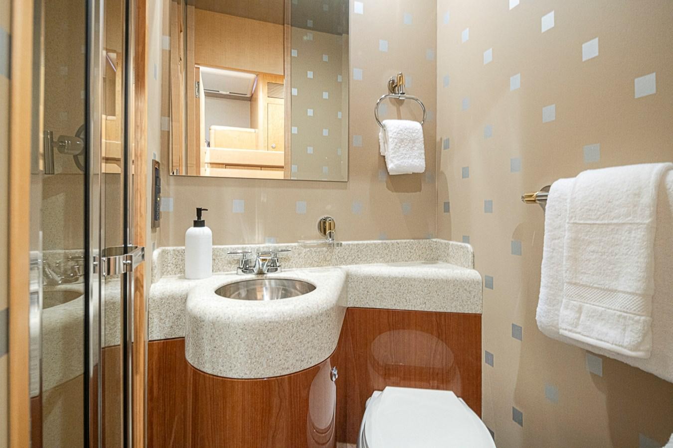 a bathroom with a sink and toilet aboard SEA SPUR Yacht for Sale