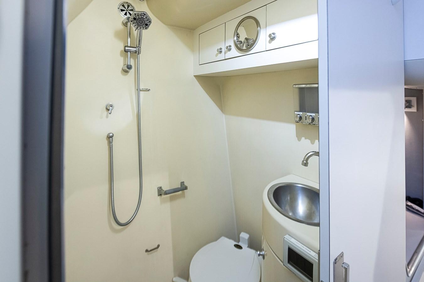 a bathroom with a sink and toilet aboard SEA SPUR Yacht for Sale