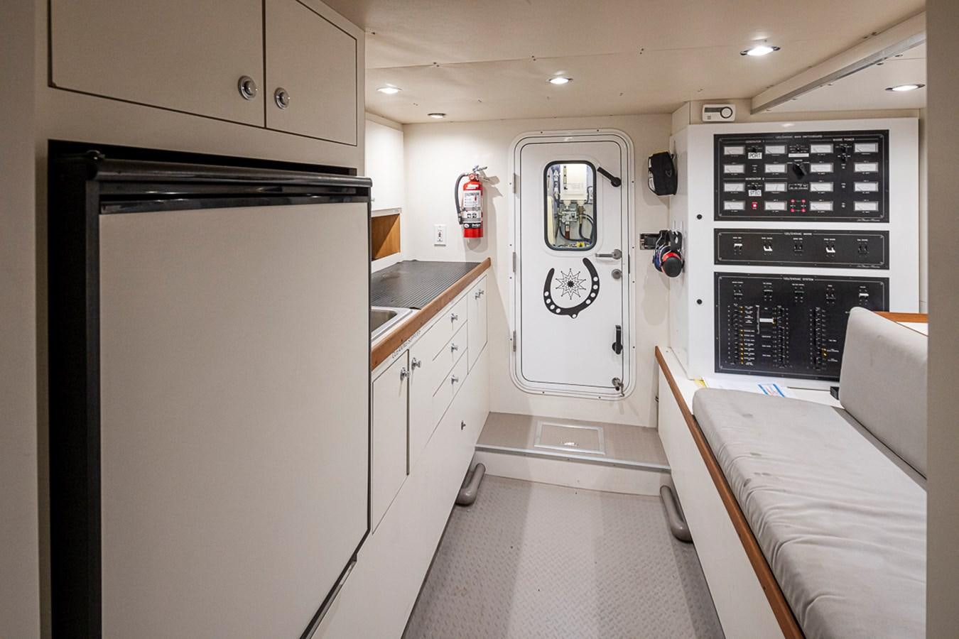 a small white kitchen aboard SEA SPUR Yacht for Sale