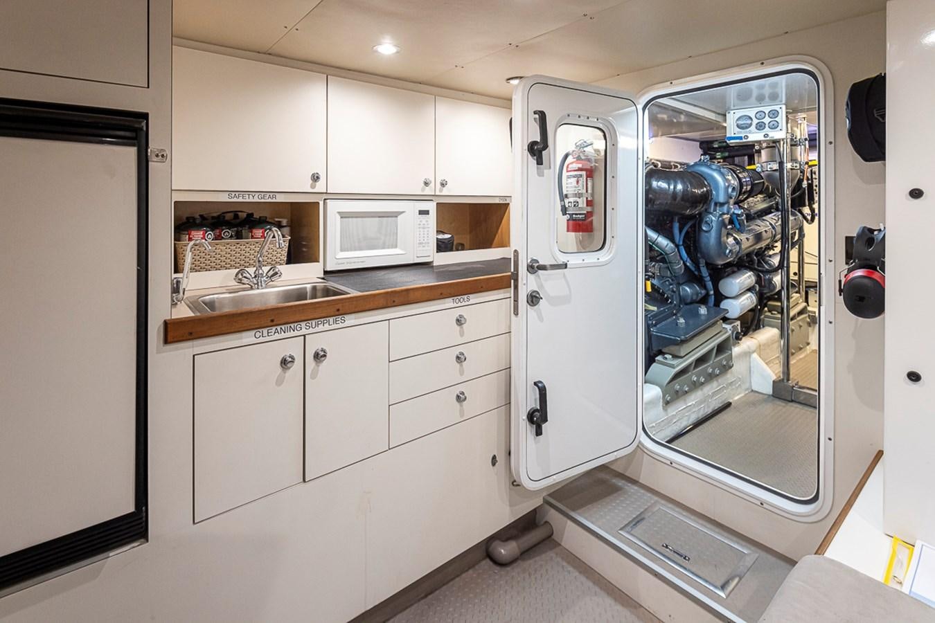 a kitchen with a washer and dryer aboard SEA SPUR Yacht for Sale