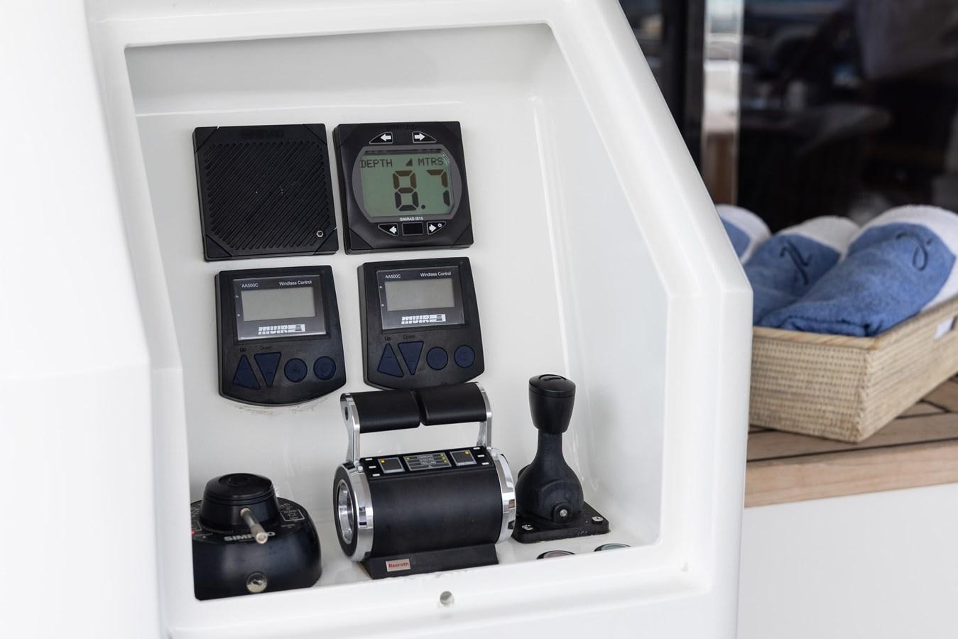 a black and silver electronic device aboard JASMINE LUNA Yacht for Sale