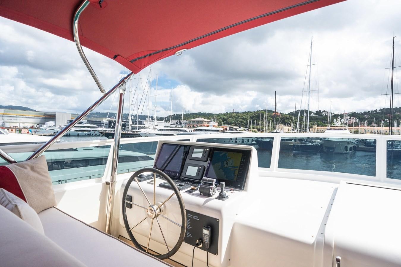 a view of a boat with a laptop on the steering wheel aboard JASMINE LUNA Yacht for Sale