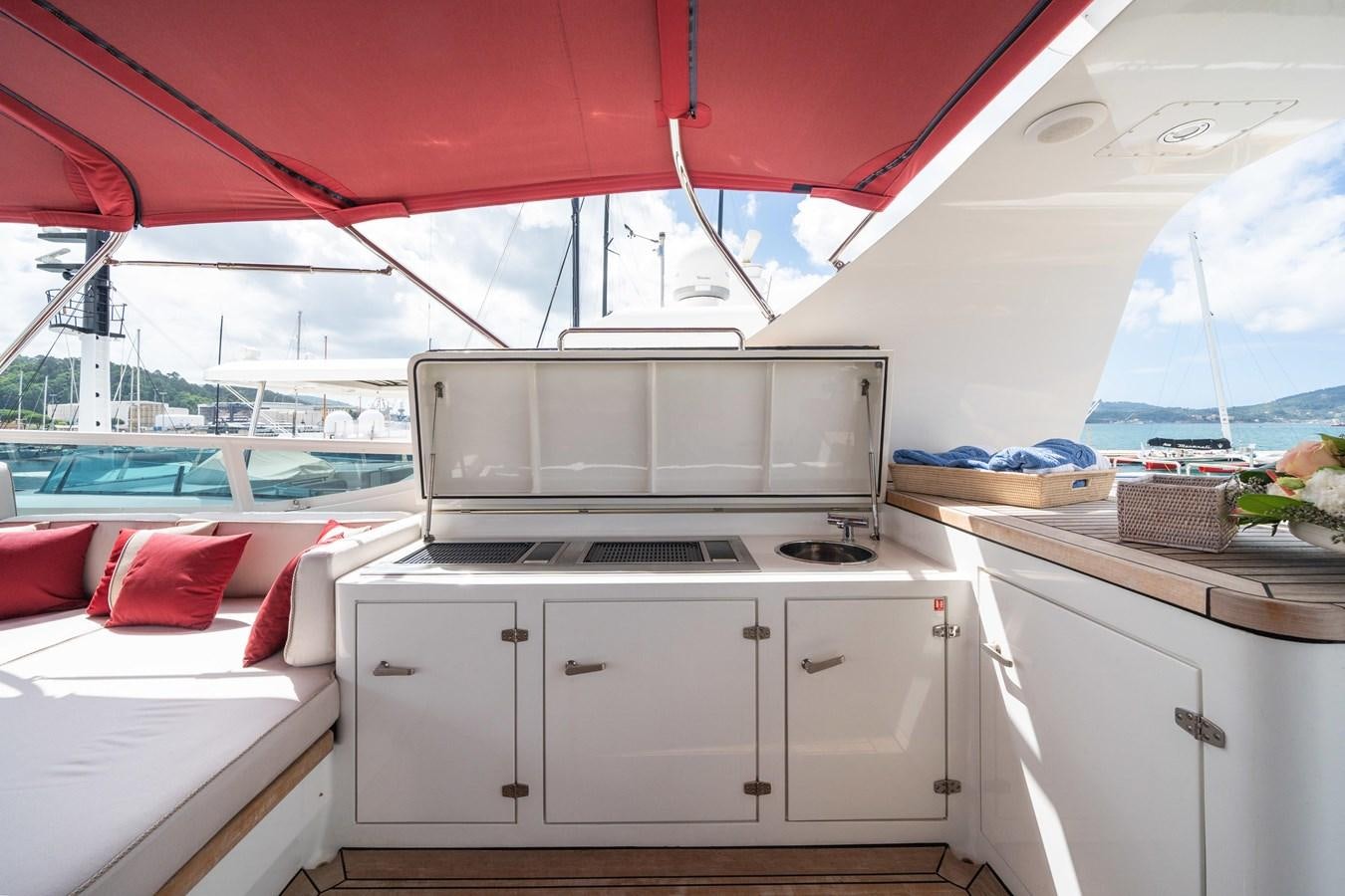 a white kitchen with a microwave oven aboard JASMINE LUNA Yacht for Sale