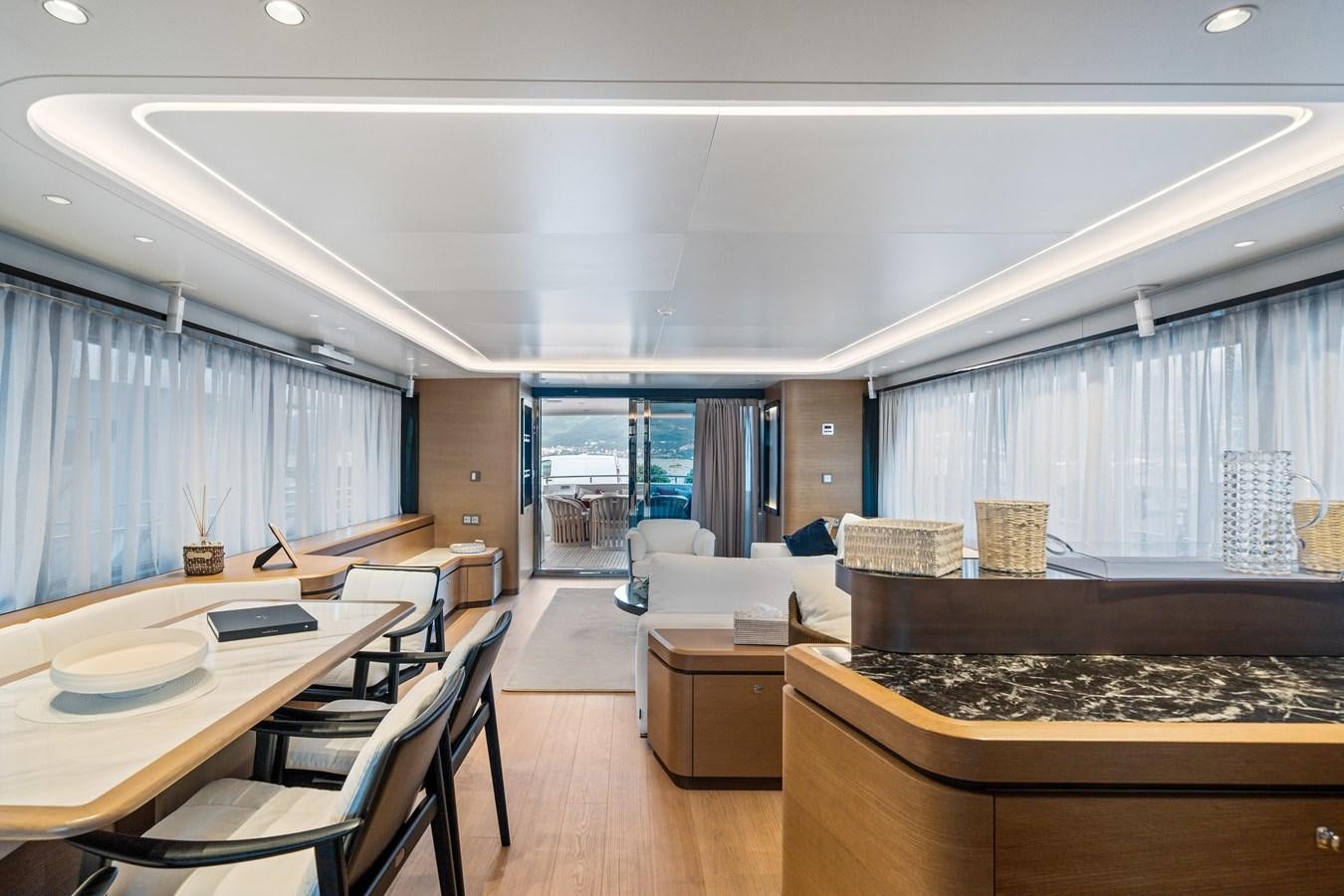 a large room with a large window aboard JASMINE LUNA Yacht for Sale