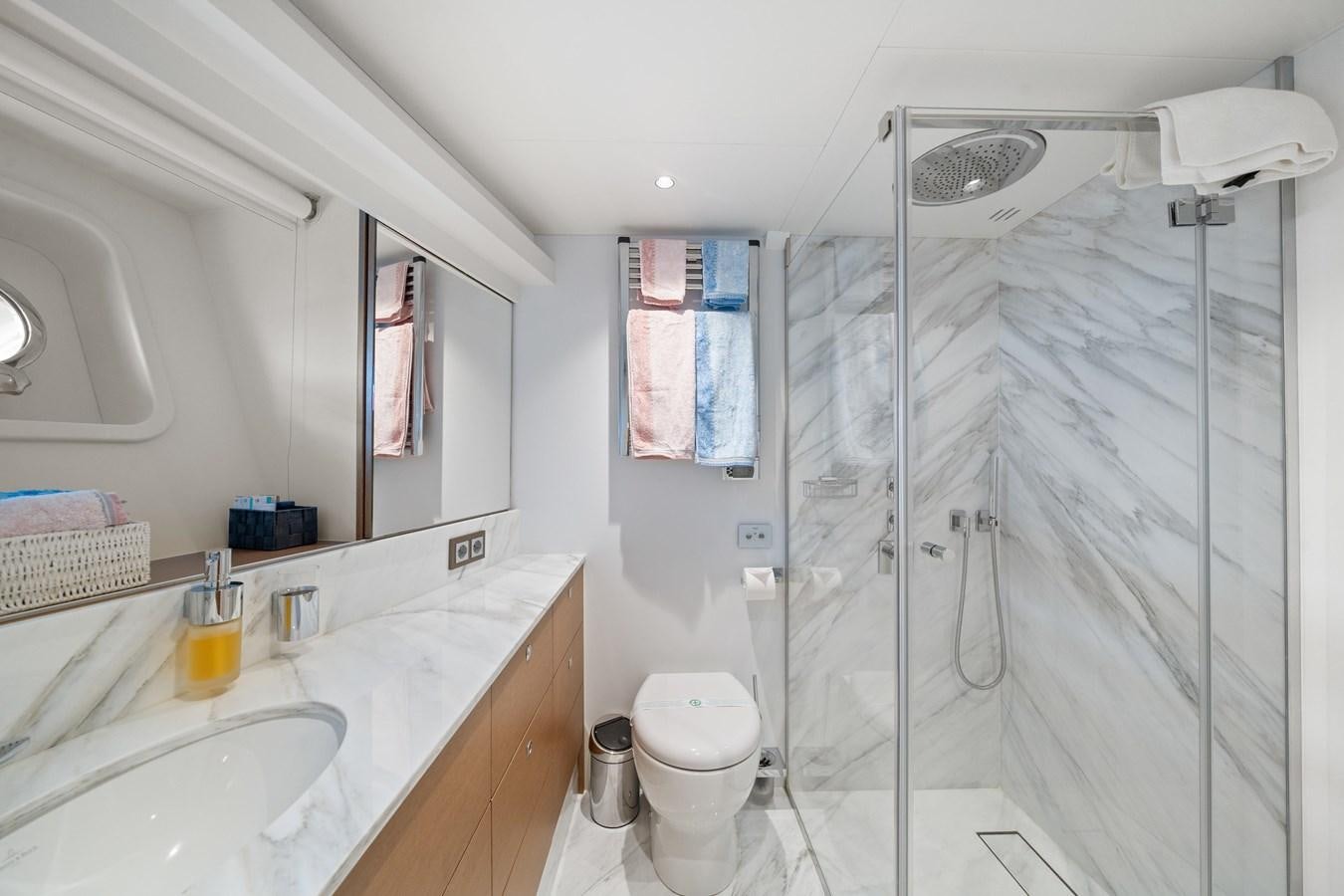 a bathroom with a shower and sink aboard JASMINE LUNA Yacht for Sale