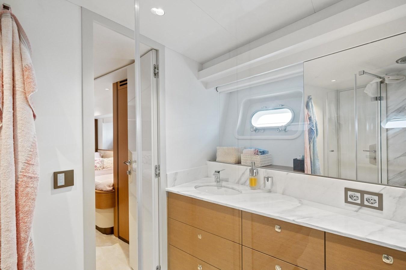 a bathroom with a large mirror aboard JASMINE LUNA Yacht for Sale