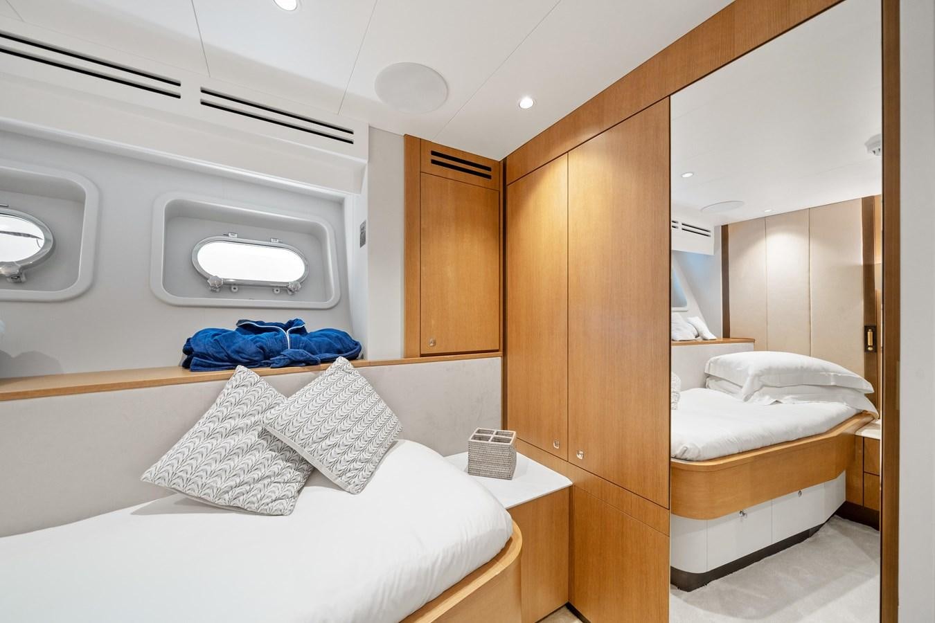 a room with a bed and a microwave aboard JASMINE LUNA Yacht for Sale
