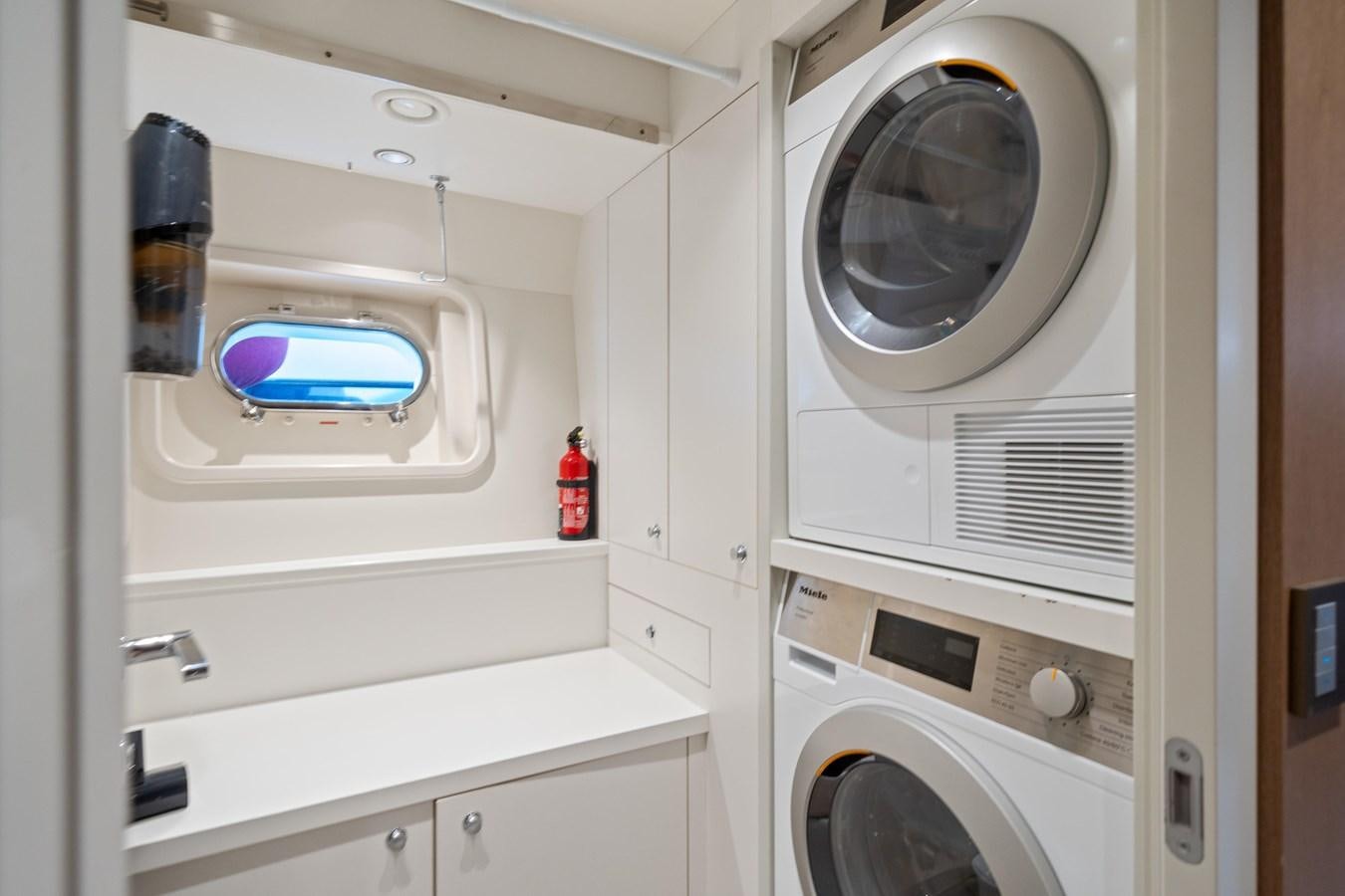 a white machine with a blue light aboard JASMINE LUNA Yacht for Sale