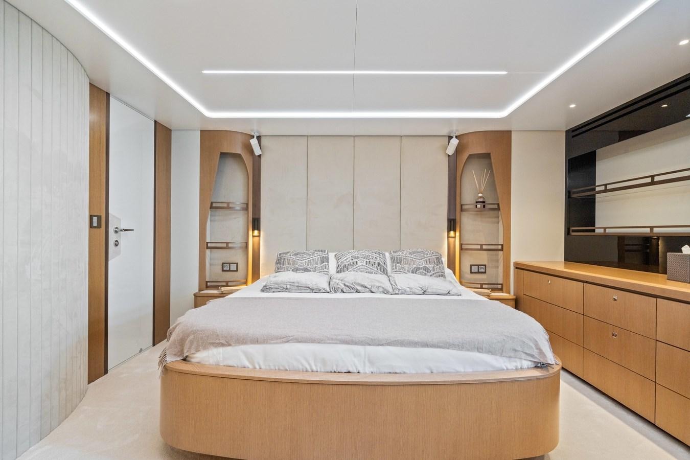 a bedroom with a bed and a closet aboard JASMINE LUNA Yacht for Sale