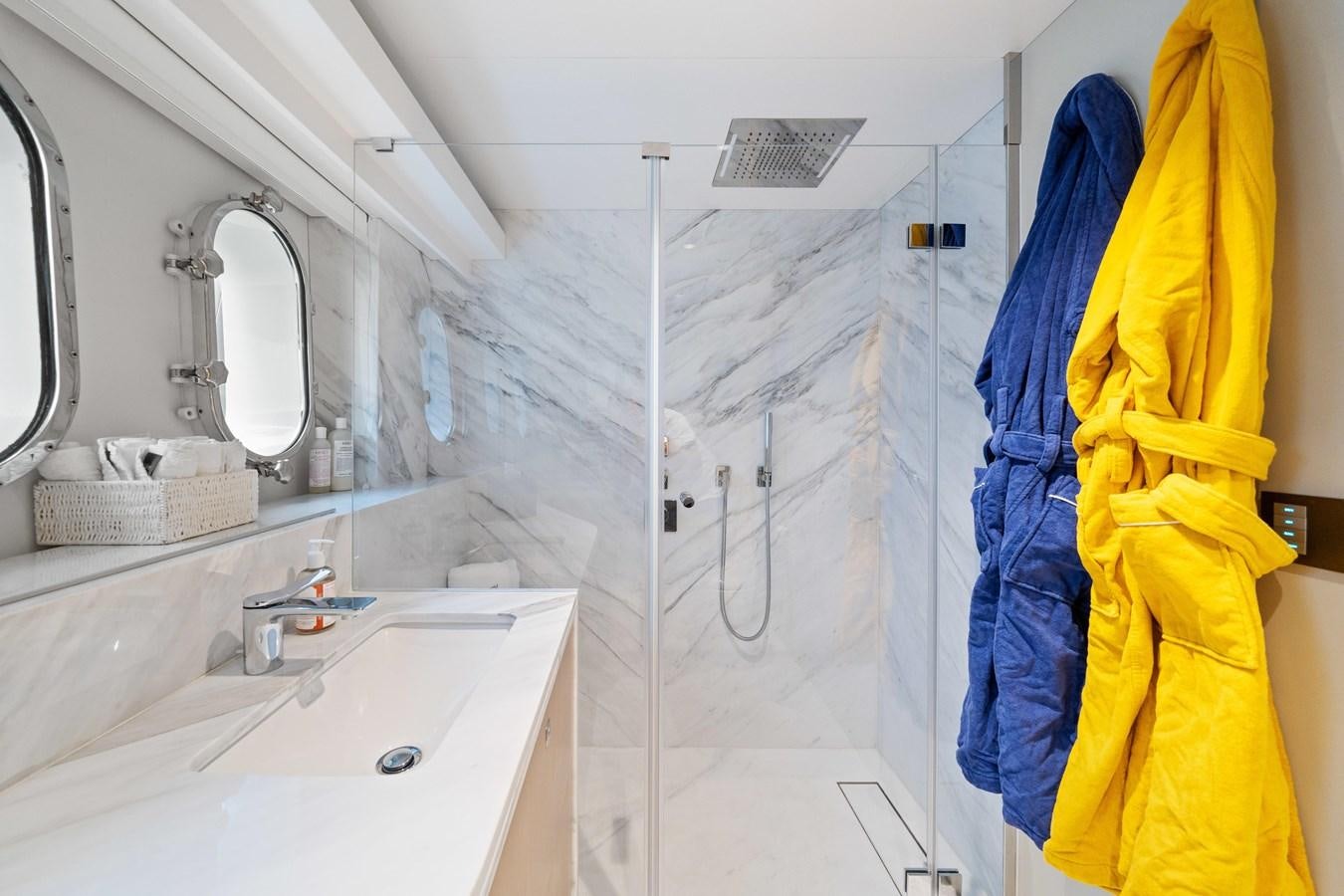 a bathroom with a sink and a mirror aboard JASMINE LUNA Yacht for Sale