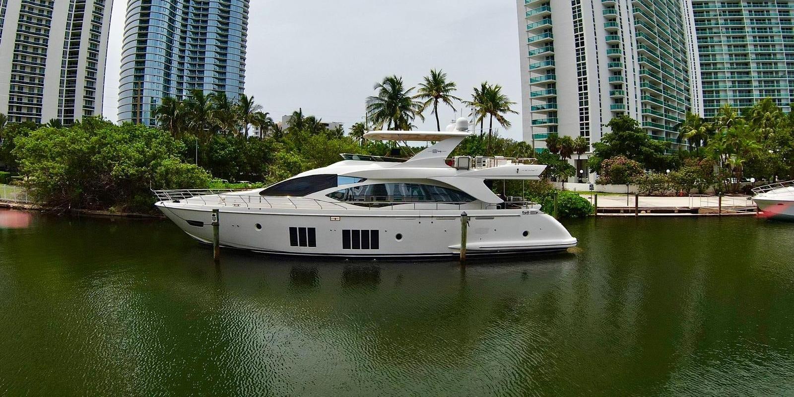 a white boat in a body of water aboard OUR TIME Yacht for Sale