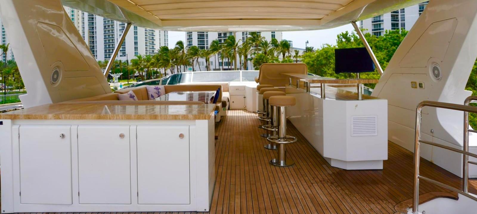 a room with a desk and a tv aboard OUR TIME Yacht for Sale