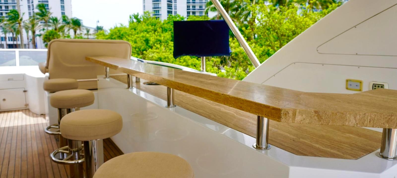 a table with chairs on it aboard OUR TIME Yacht for Sale