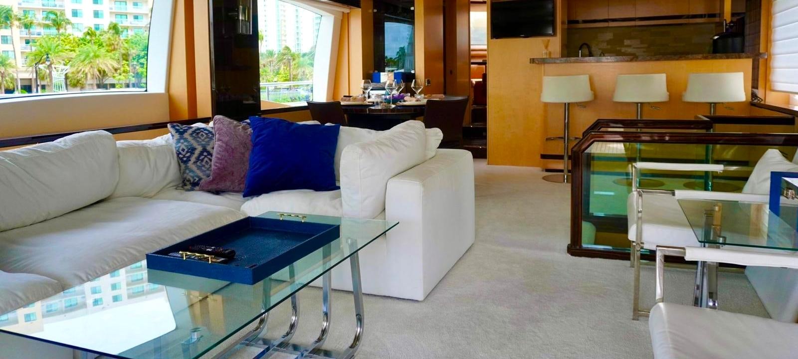 a living room with a couch and a table aboard OUR TIME Yacht for Sale