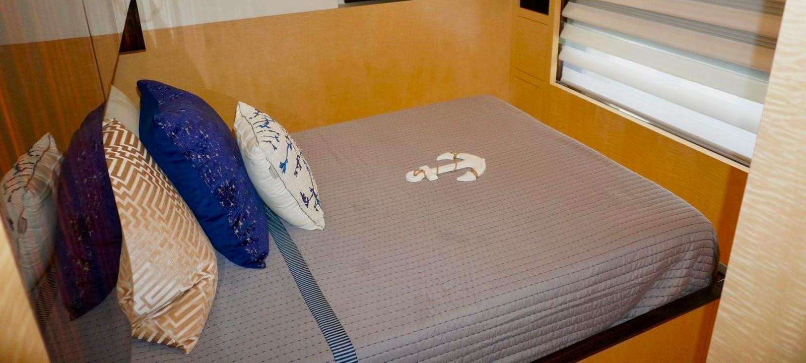 a pair of blue and white sneakers on a wood floor aboard OUR TIME Yacht for Sale