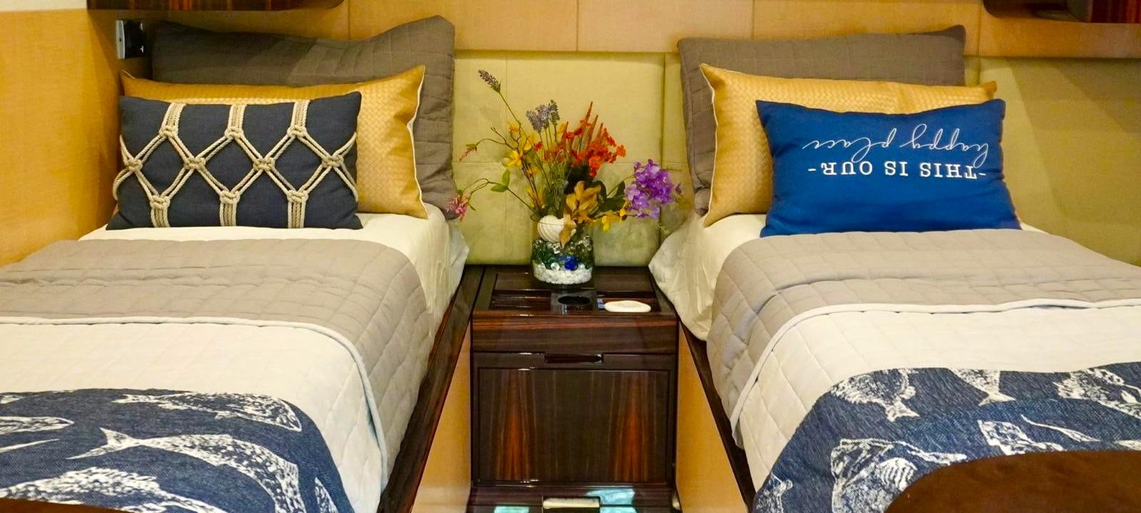 a couple of beds in a hotel room aboard OUR TIME Yacht for Sale