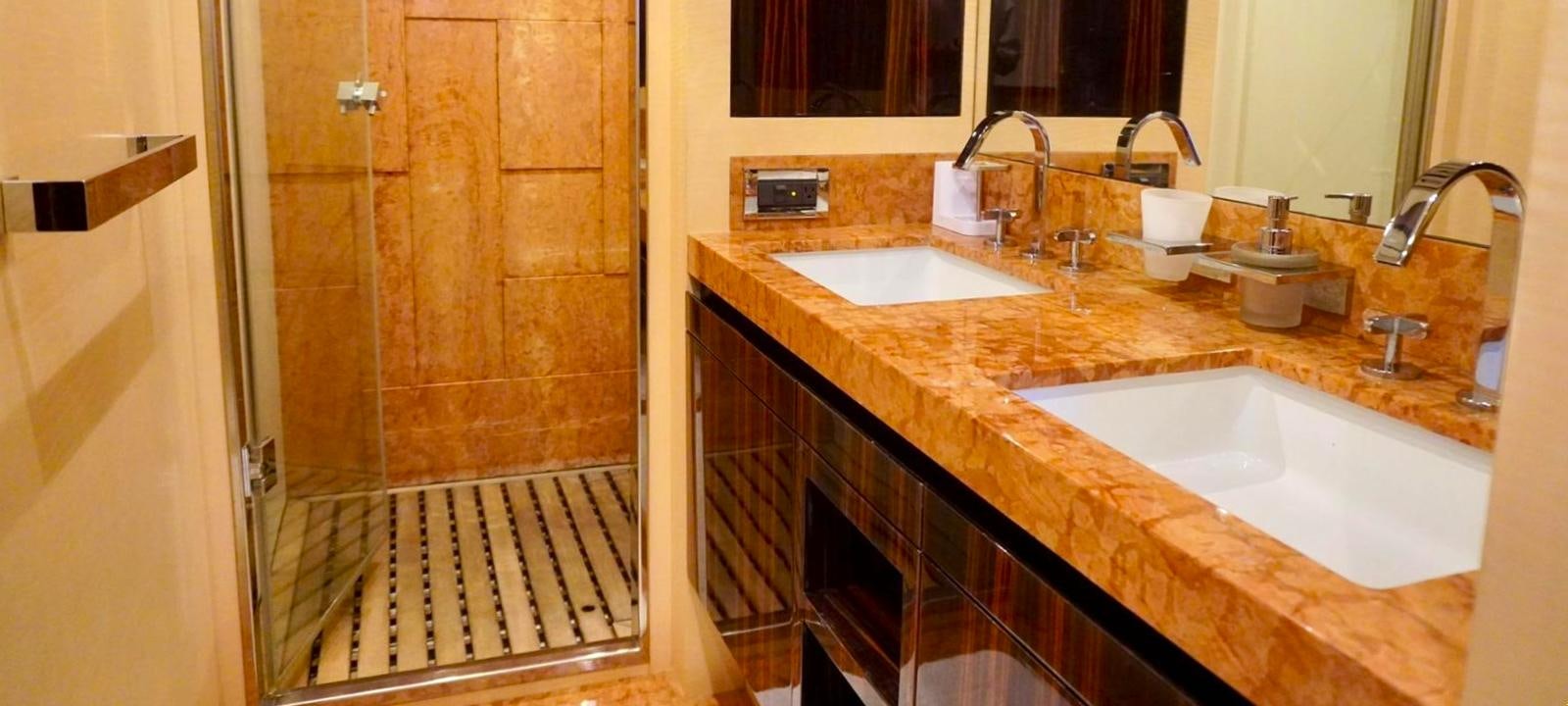 a bathroom with a countertop sink and a shower aboard OUR TIME Yacht for Sale