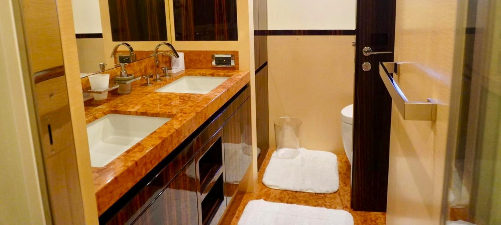 a bathroom with a sink and a mirror aboard OUR TIME Yacht for Sale