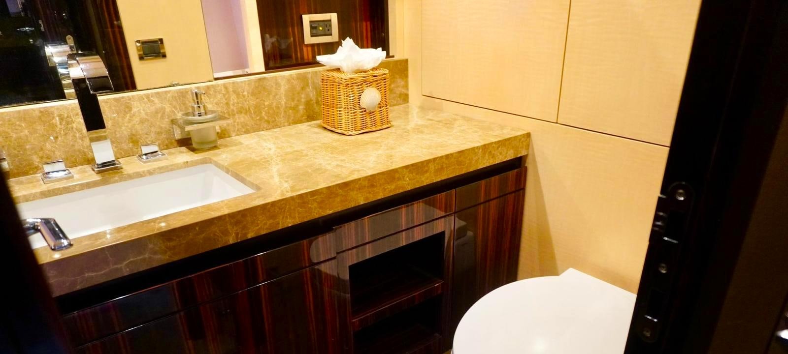 a bathroom with a countertop sink and mirror aboard OUR TIME Yacht for Sale