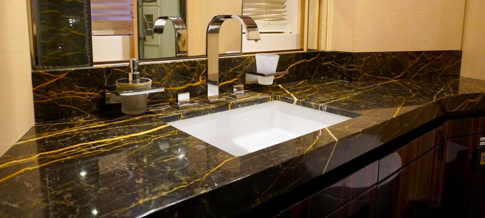 a bathroom with a large countertop aboard OUR TIME Yacht for Sale