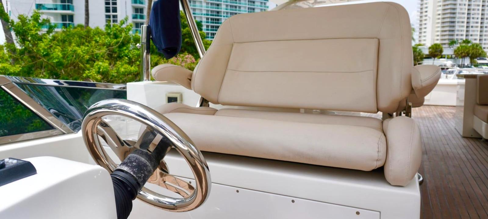 a white chair on a car aboard OUR TIME Yacht for Sale