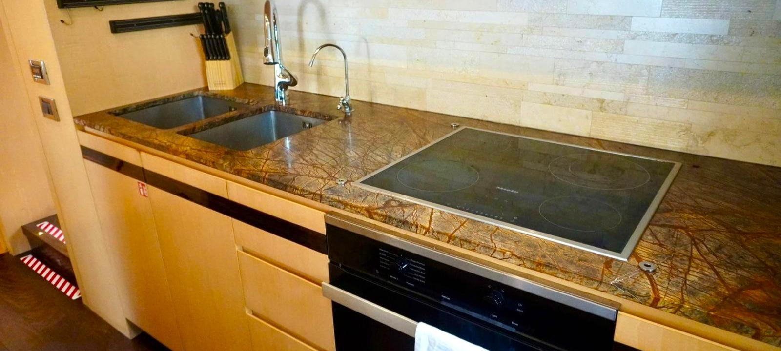 a kitchen with a marble counter top aboard OUR TIME Yacht for Sale