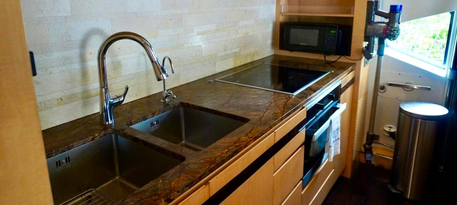 a kitchen with a sink and a microwave aboard OUR TIME Yacht for Sale