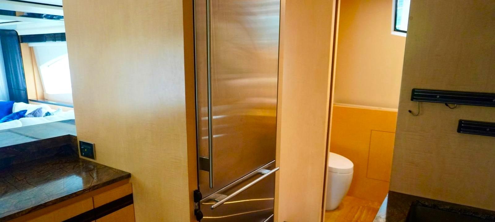 a bathroom with a glass shower aboard OUR TIME Yacht for Sale