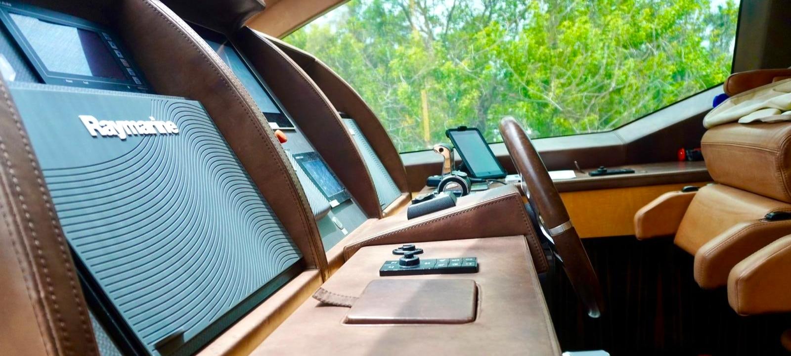 a car with a screen on the window aboard OUR TIME Yacht for Sale