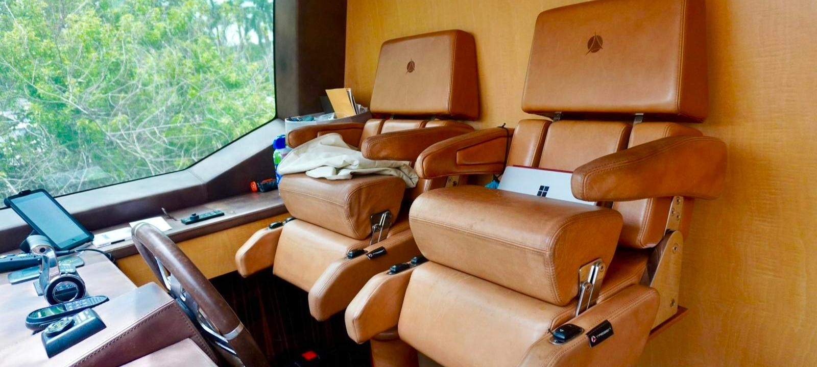 an airplane with a desk and a computer aboard OUR TIME Yacht for Sale