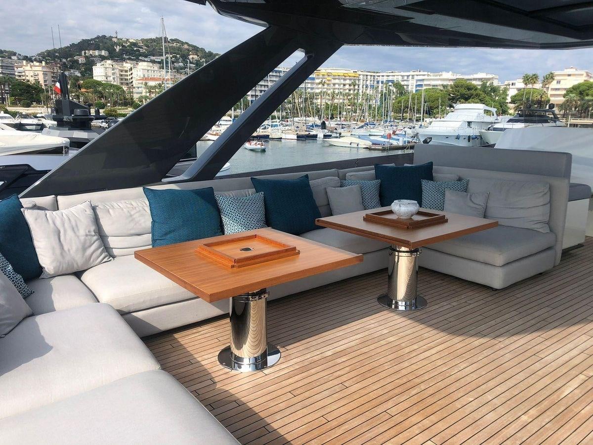 a couch and a table on a deck aboard NUMERO 5 Yacht for Sale