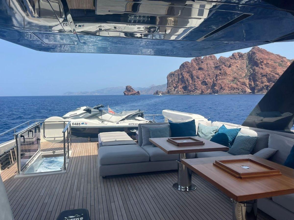 a room with a couch and a table and chairs aboard NUMERO 5 Yacht for Sale
