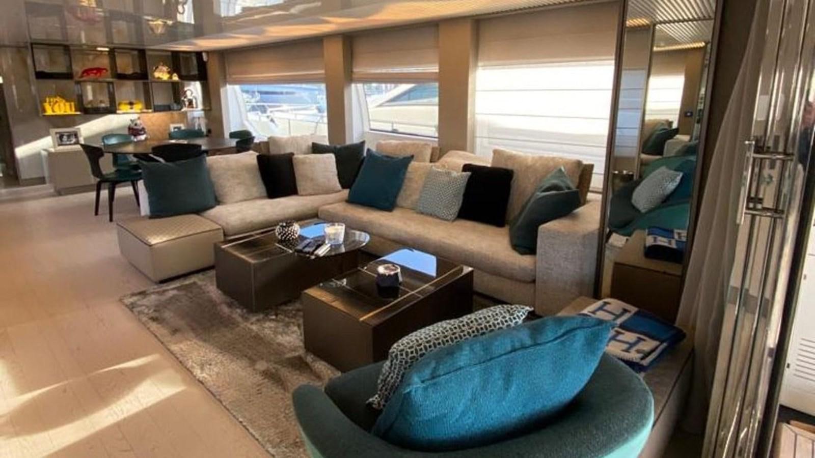 a living room with a couch and a coffee table aboard NUMERO 5 Yacht for Sale