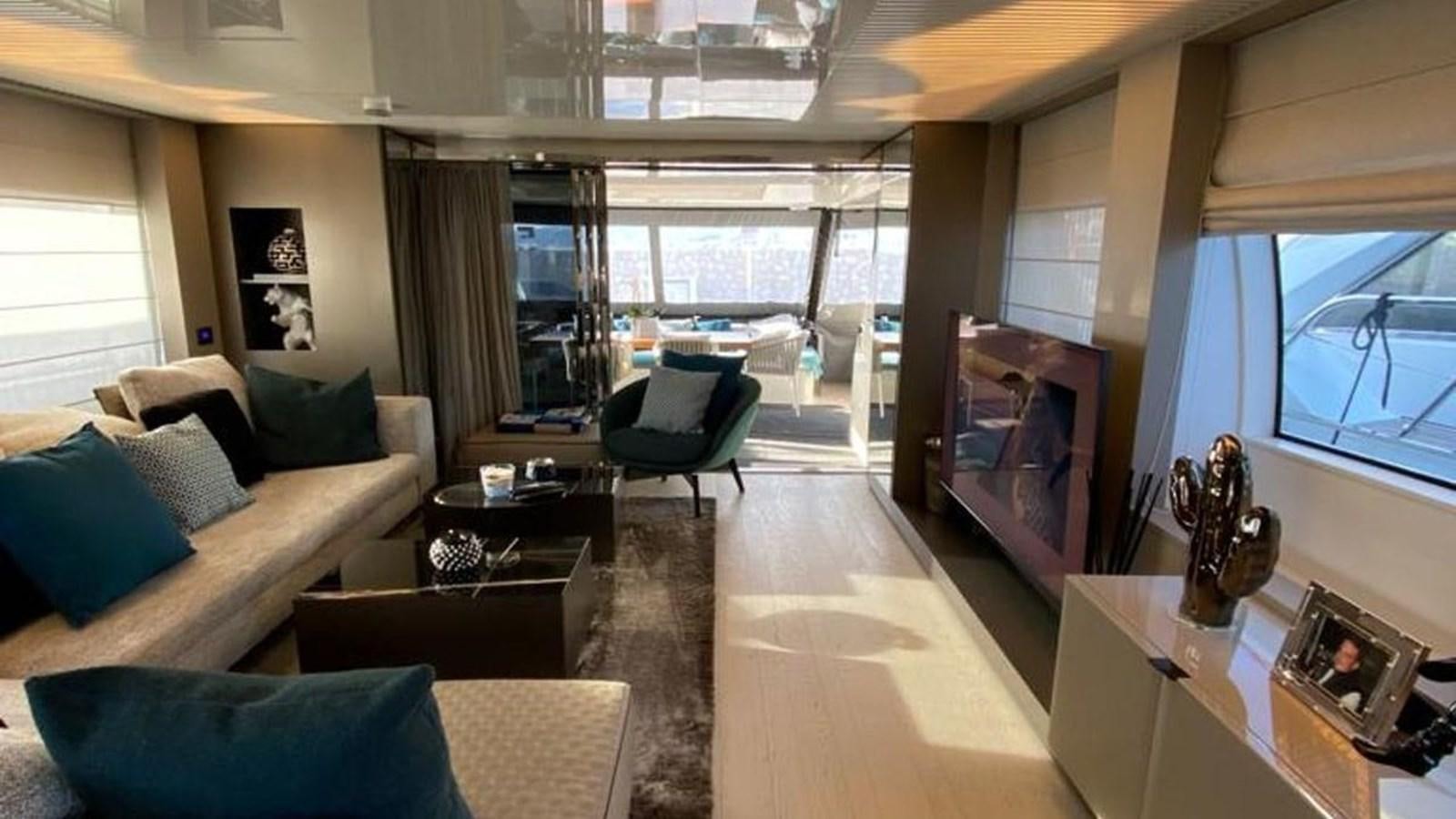 a living room with a large window aboard NUMERO 5 Yacht for Sale