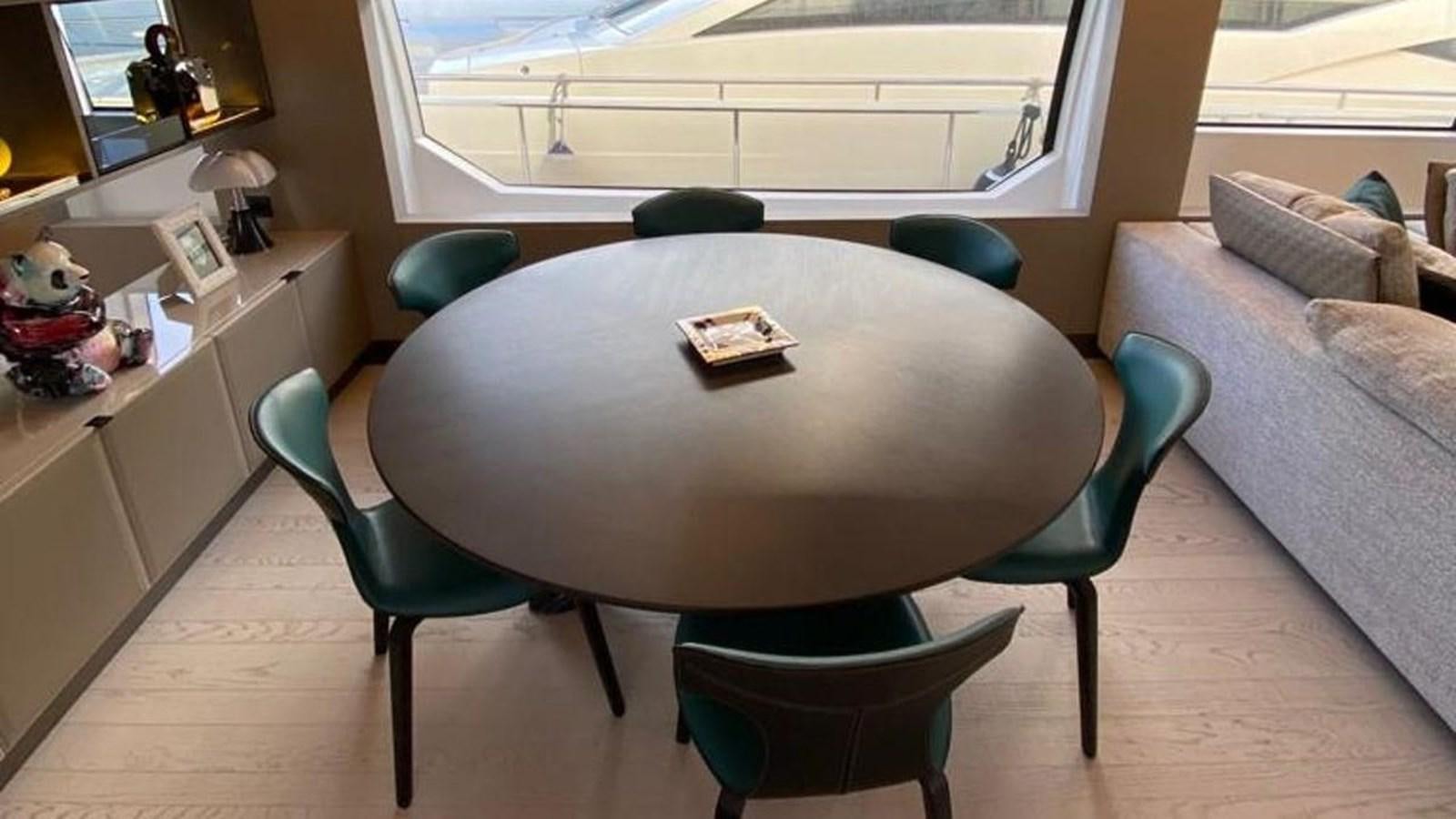 a table with chairs around it aboard NUMERO 5 Yacht for Sale
