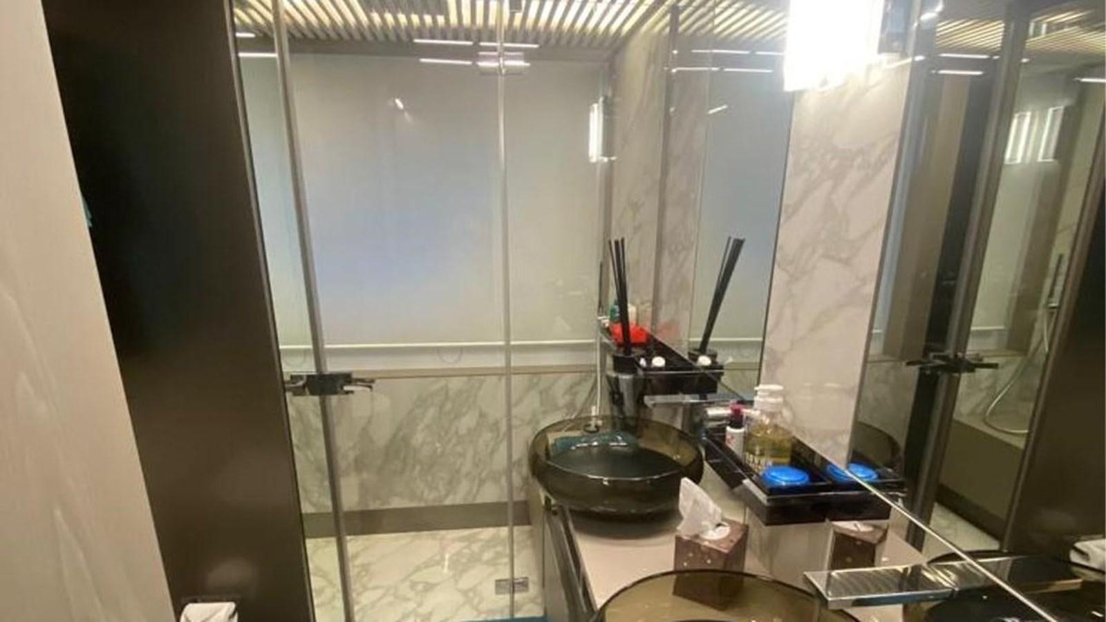 a bathroom with a glass shower aboard NUMERO 5 Yacht for Sale