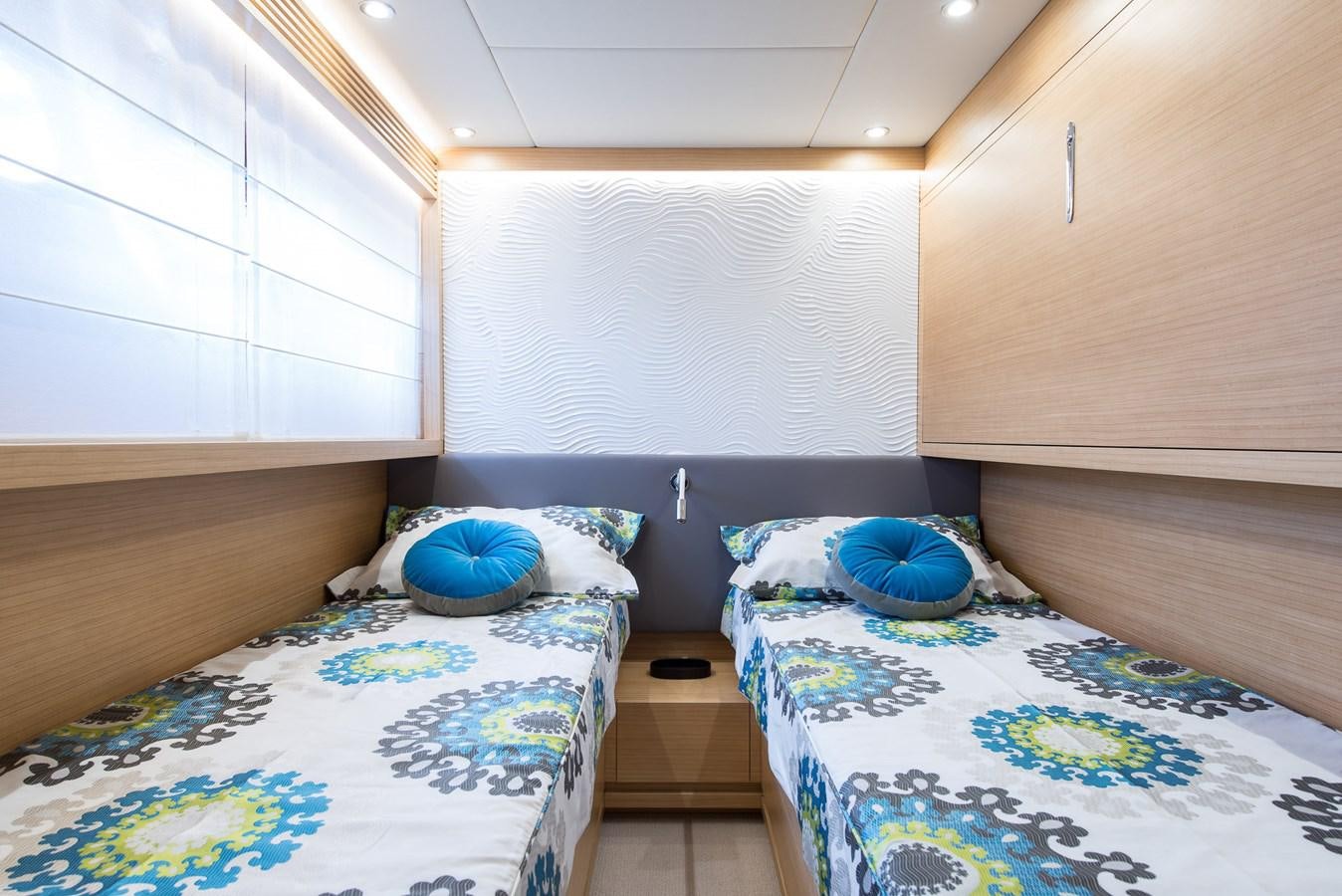 a room with a couple of beds aboard MIREDO Yacht for Sale
