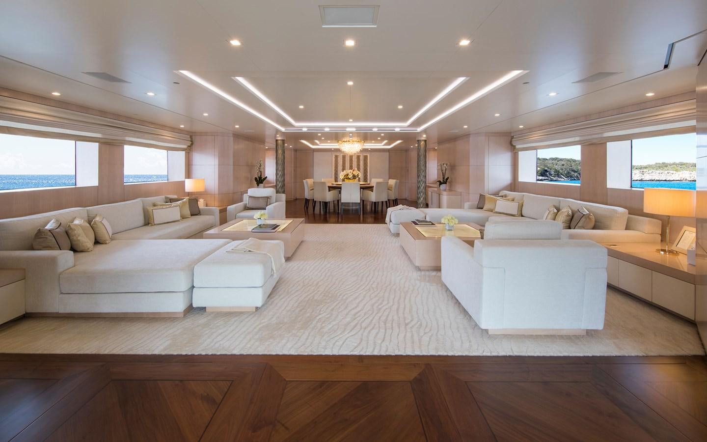 a living room with a couch and a table aboard ROMA Yacht for Sale