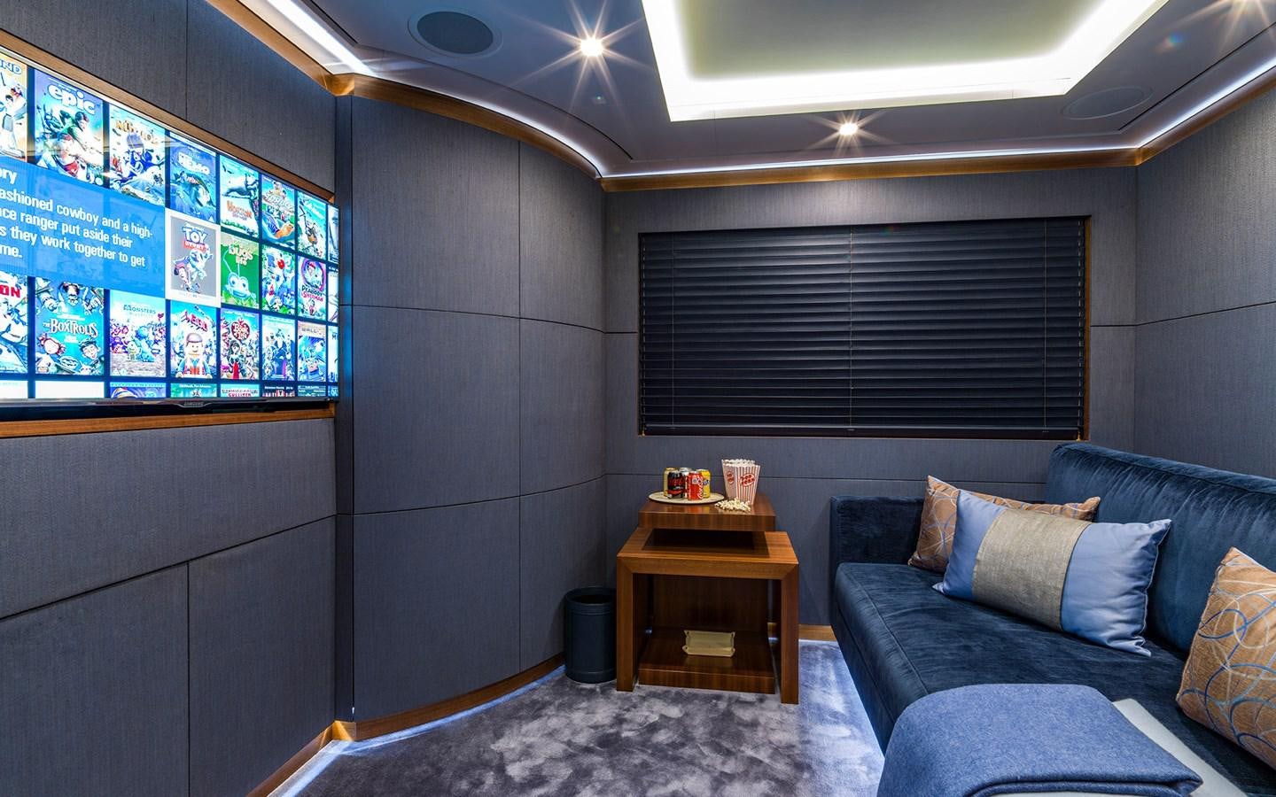 a room with a couch and a coffee table aboard ROMA Yacht for Sale