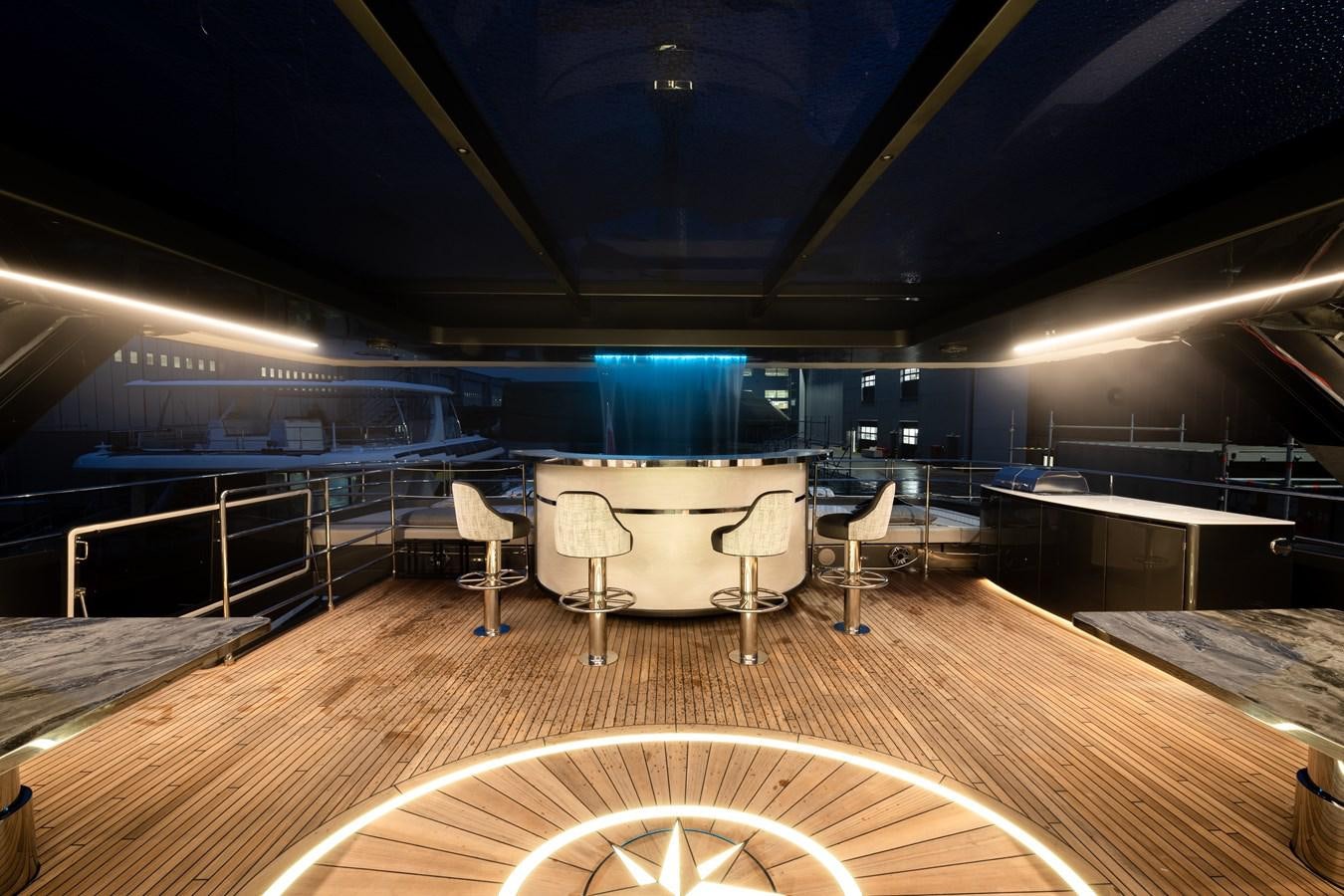 a room with a table and chairs aboard SUNREEF 80 POWER Yacht for Sale