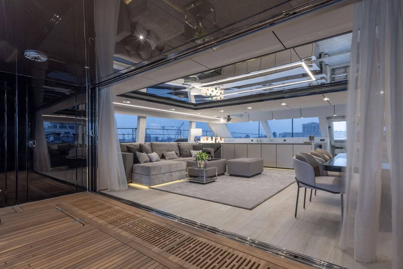 a room with a couch and a table aboard SUNREEF 80 POWER Yacht for Sale