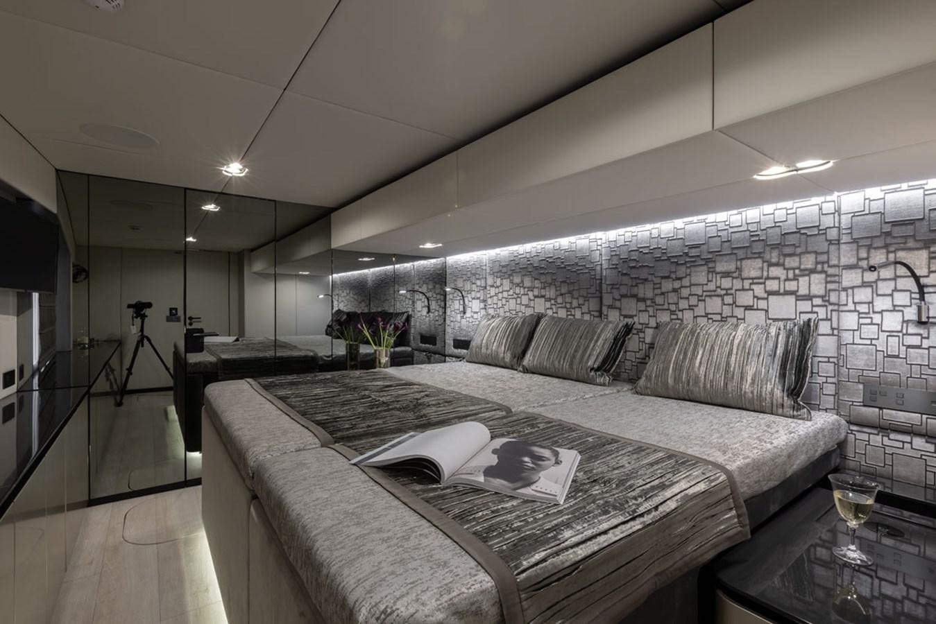 a room with a large bed aboard SUNREEF 80 POWER Yacht for Sale