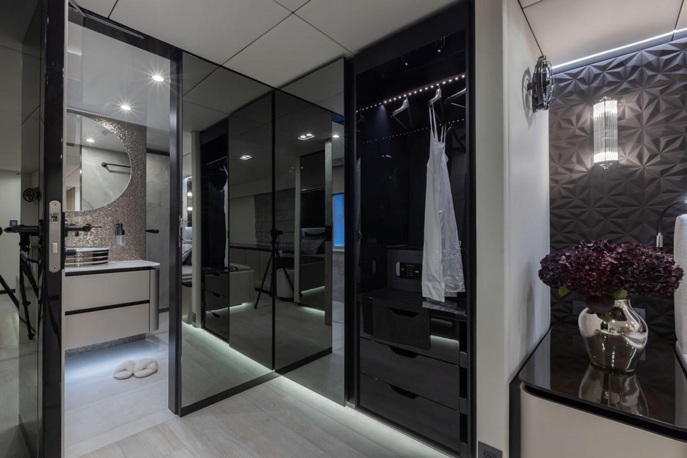 a room with glass doors aboard SUNREEF 80 POWER Yacht for Sale