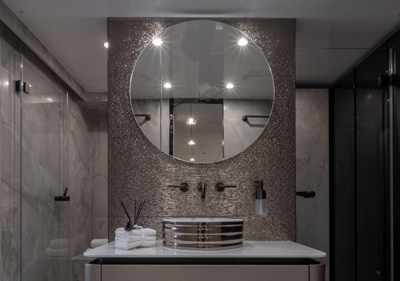 a bathroom with a large mirror aboard SUNREEF 80 POWER Yacht for Sale
