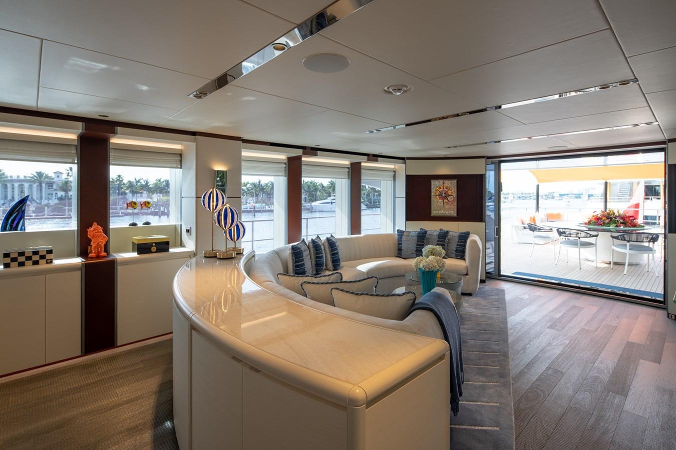 a living room with a large window aboard BOOK ENDS Yacht for Sale