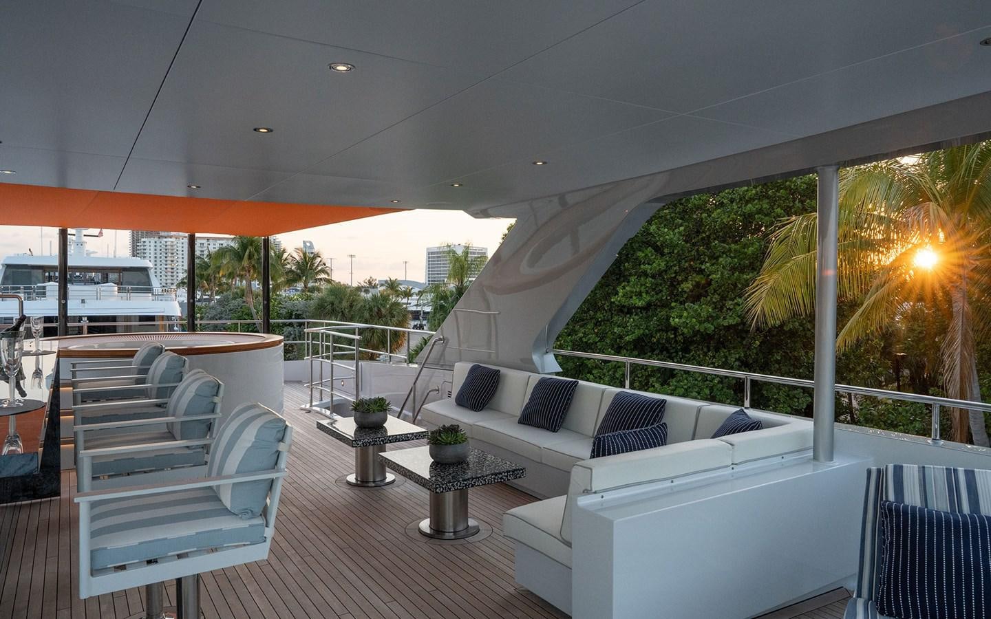 a patio with a table and chairs aboard BOOK ENDS Yacht for Sale