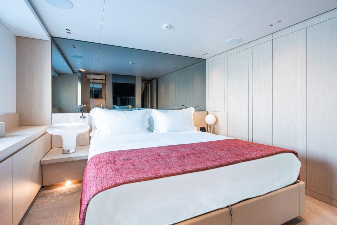a bed in a room aboard AMI Yacht for Sale