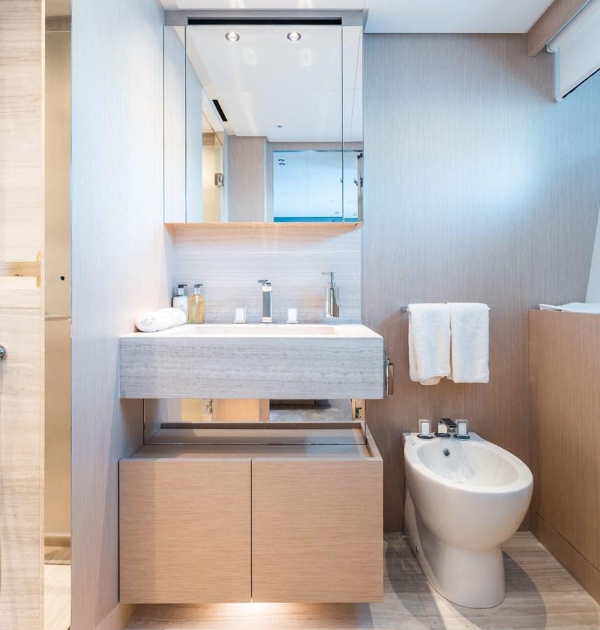 a bathroom with a sink and a mirror aboard AMI Yacht for Sale