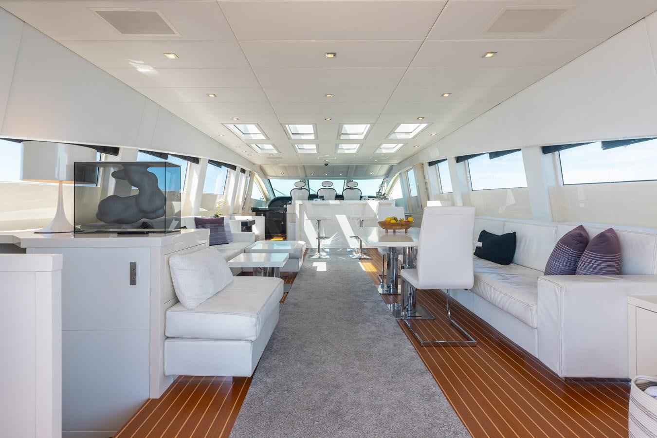a room with a couch and a television aboard VENTURE Yacht for Sale