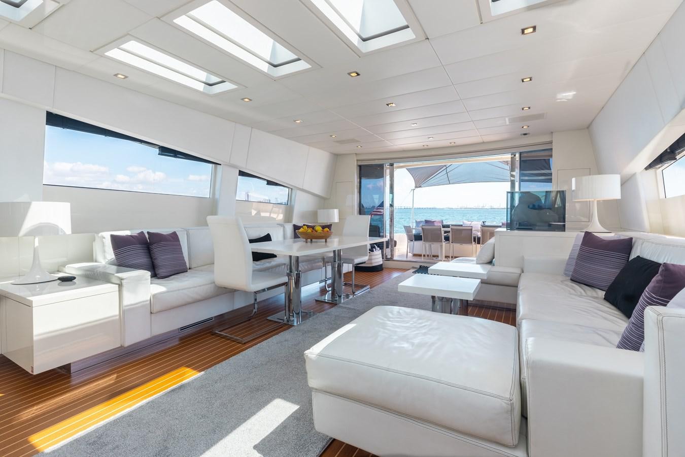 a living room with a large window aboard VENTURE Yacht for Sale